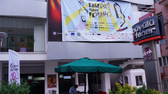 In the image, there is a photo taken outside of the Büyülü Fener Kızılay cinema, where the physical screenings of Ankara are held.