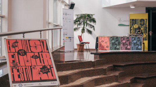 Colorful festival posters and festival stand can be seen in a frame from the foyer of Doğan Taşdelen Contemporary Arts Center.