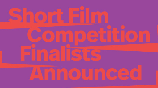 The text reads: "Finalists of the short film competition are announced," placed on a white background, accompanied by red letters.
